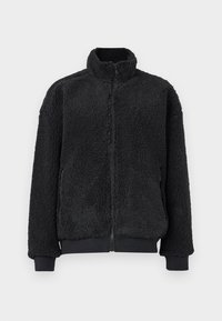 Μαύρο fleece μπουφάν με ψηλό γιακά, κλείσιμο με φερμουάρ και ριμπ μανσέτες. Η υφή είναι μαλακή και αφράτη, με χαλαρή εφαρμογή.