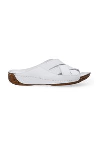Witte leren slippers met gekruiste banden, kurken loopzool, textuurdetails en gestikte randen. Open ontwerp aan de achterkant voor gemakkelijk aan- en uittrekken.