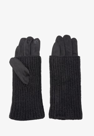 Schwarze gestrickte Handschuhe mit gerippter Textur, die eine glatte innere Schicht und ein kleines gesticktes Detail im Bereich des Handgelenks aufweisen.