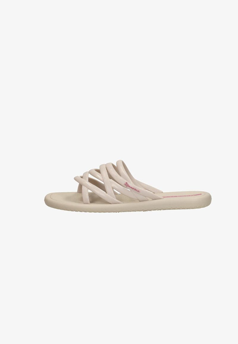 Beige litte sandle dengan beberapa tali saling silang dan sol yang empuk.
