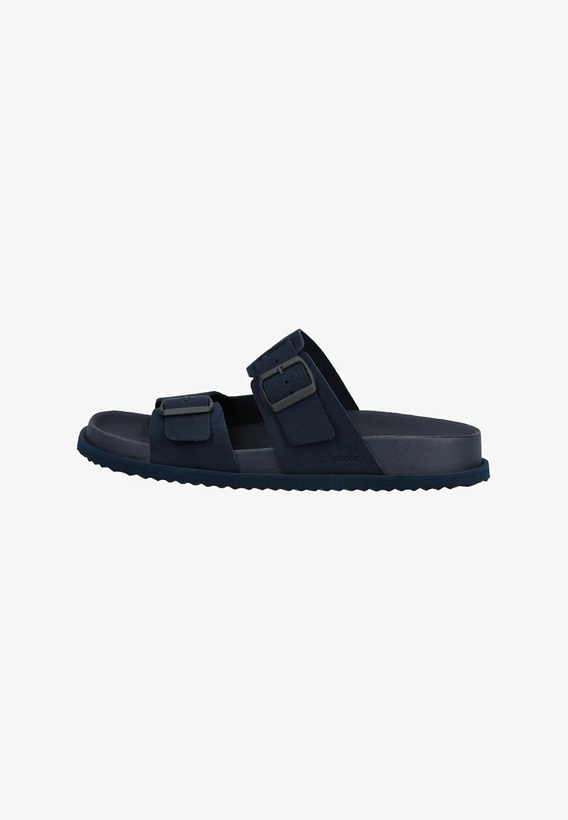 Sandale à glissière bleu marine avec deux brides ajustables à boucle et une semelle légèrement texturée pour une meilleure adhérence, conçue pour un usage décontracté.