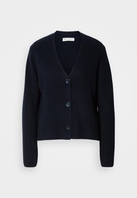 Cardigan côtelé bleu marine avec un col en V, quatre boutons à l'avant et des manches longues. Le tissu présente une finition texturée.