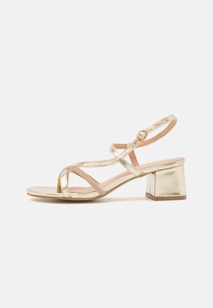 ANSHIKA - Sandalen - gold