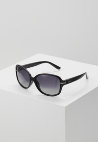 Black, oversized sunglasses with gradient lenses. Smooth plastic frame, featuring a decorative accent on the hinges. Adjustable temple arms.