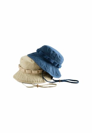 Two cotton bucket hats, one beige and one blue, each with chin straps and stitched band detailing, stacked against a white background.