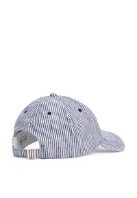 Striped baseball cap in navy and white fabric, featuring a curved brim, adjustable strap, and ventilated grommets on the sides.