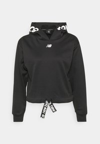 Czarna krótka bluza z miękkiego materiału, z kapturem na sznurek, białym logo na piersi oraz sygnowanymi troczkami na dole.