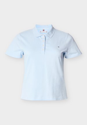 Light blue cotton polo shirt with a collar, short sleeves, and four-button placket. Features a small logo on the left chest.
