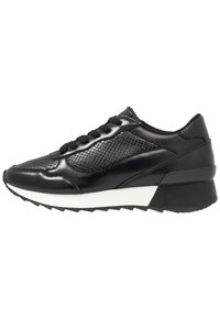 Black sneaker with a smooth leather and mesh upper, featuring a textured pattern, black laces, and a contrasting white midsole.