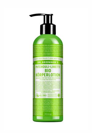 Green bottle of Dr. Bronner’s Patchouli-Limette organic body lotion with black pump dispenser and detailed German text label.