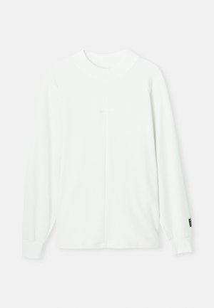 Biały, długi sweter z okrągłym dekoltem, ściągaczami na rękawach i centralnym szwem biegnącym pionowo wzdłuż przodu. Miękka tkanina.