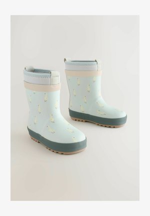 Vaaleansiniset kumisaappaat, joissa on keltainen ankka-kuvio, kumin materiaali, harmaa pohja ja vaaleanharmaa mansetti, jossa on vetolenkit helppoa pukemista varten.