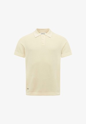 Korte mouw crème poloshirt met drie knoppen, gestructureerde stof en een subtiel merkembleem vlak bij de zoom.