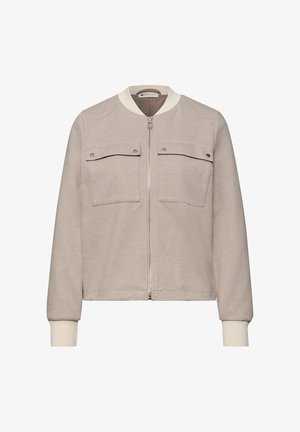 Beige jas met ritssluiting, twee klepzakken aan de voorkant, geribbelde manchetten en kraag, met een subtiele visgraatstructuur.