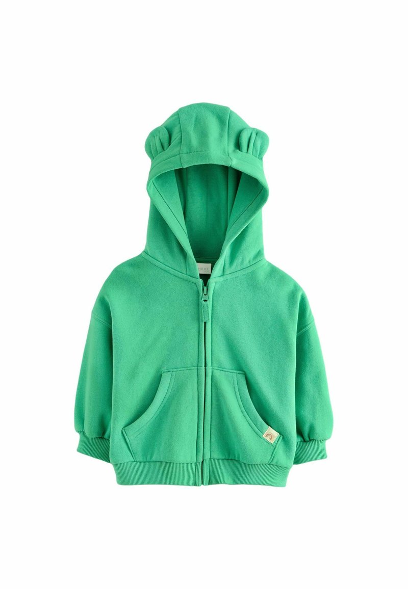 Felpa verde con zip e orecchie di orso, realizzata in tessuto morbido. Presenta tasche frontali e polsini a costine, con una piccola etichetta sull'orlo.