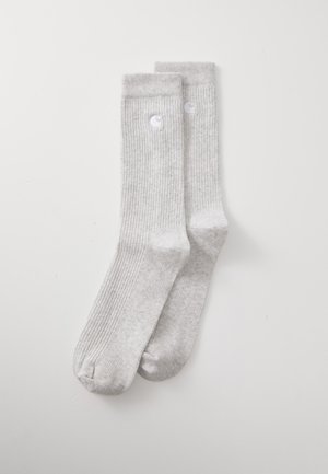 Gray ribbed socks made from soft fabric, featuring a subtle logo accent. The design includes a standard length with reinforced toe and heel.