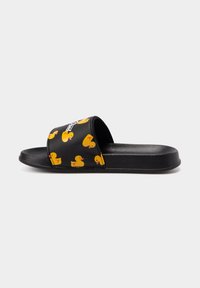 Black slide sandals with a smooth texture, featuring a pattern of yellow rubber ducks on the strap and a flat black sole.