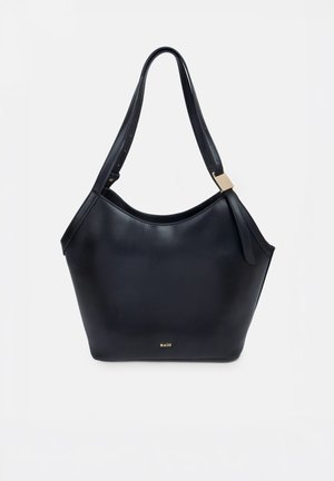 Black leather shoulder bag with adjustable strap and gold-tone accent, small gold logo at bottom center.