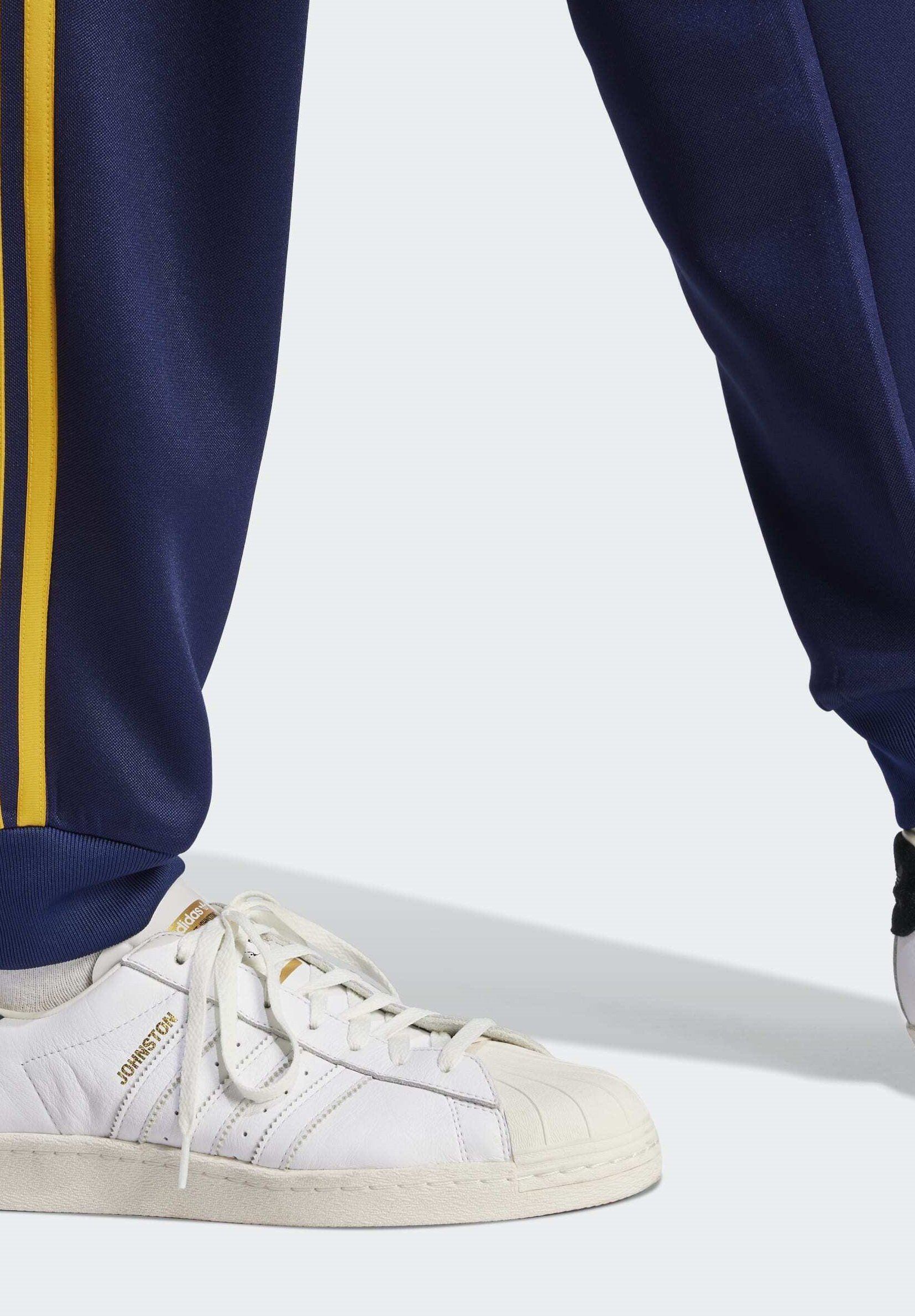 adidas sst track pants yellow