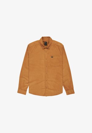 Långärmad skjorta med knappar i ljusbrun kordflod. Har en bröstficka och en svart logolapp på fickan.