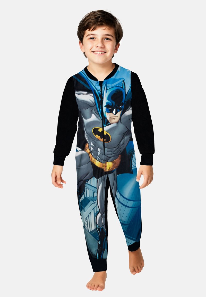 Tutina a tema Batman con design metà nero e metà stampato, caratterizzata da grafiche da supereroe, chiusura con zip e tessuto morbido e liscio.