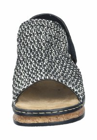 Black and white woven slide sandal with an open toe, cork sole, and a navy accent strap at the back. Features textured upper material.