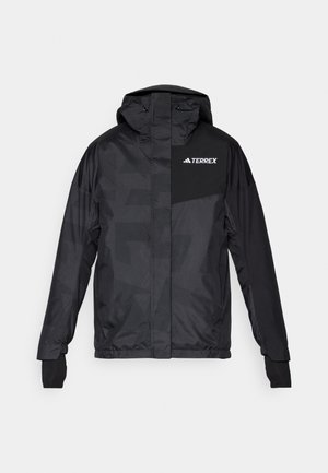 Schwarze Terrex-Jacke mit Kapuze, Reißverschluss vorne und Daumenlöchern. Hergestellt aus glattem, leichtem Material mit einem subtilen geometrischen Muster.