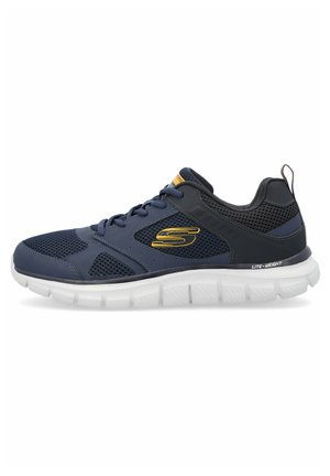 Granatowe buty sportowe z siateczkową cholewką, lekką białą podeszwą, złotymi akcentami, sznurowadłami oraz logo na boku. Posiadają wyściełany kołnierz i język.