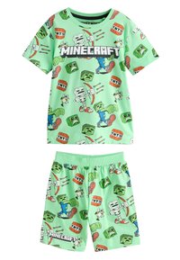 Ensemble de pyjama vert clair sur le thème de Minecraft comprenant une chemise à manches courtes et un short. Les motifs incluent des personnages, des blocs et des graphismes de TNT.