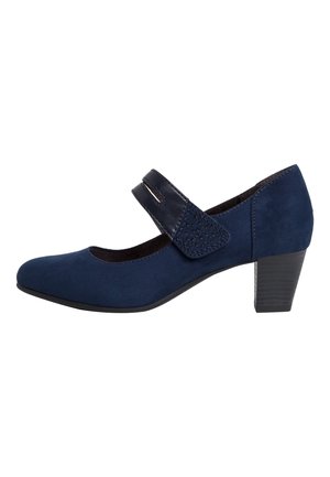 Chaussure Mary Jane en daim bleu marine avec petit talon bloc, bride en Velcro unique et bout arrondi.
