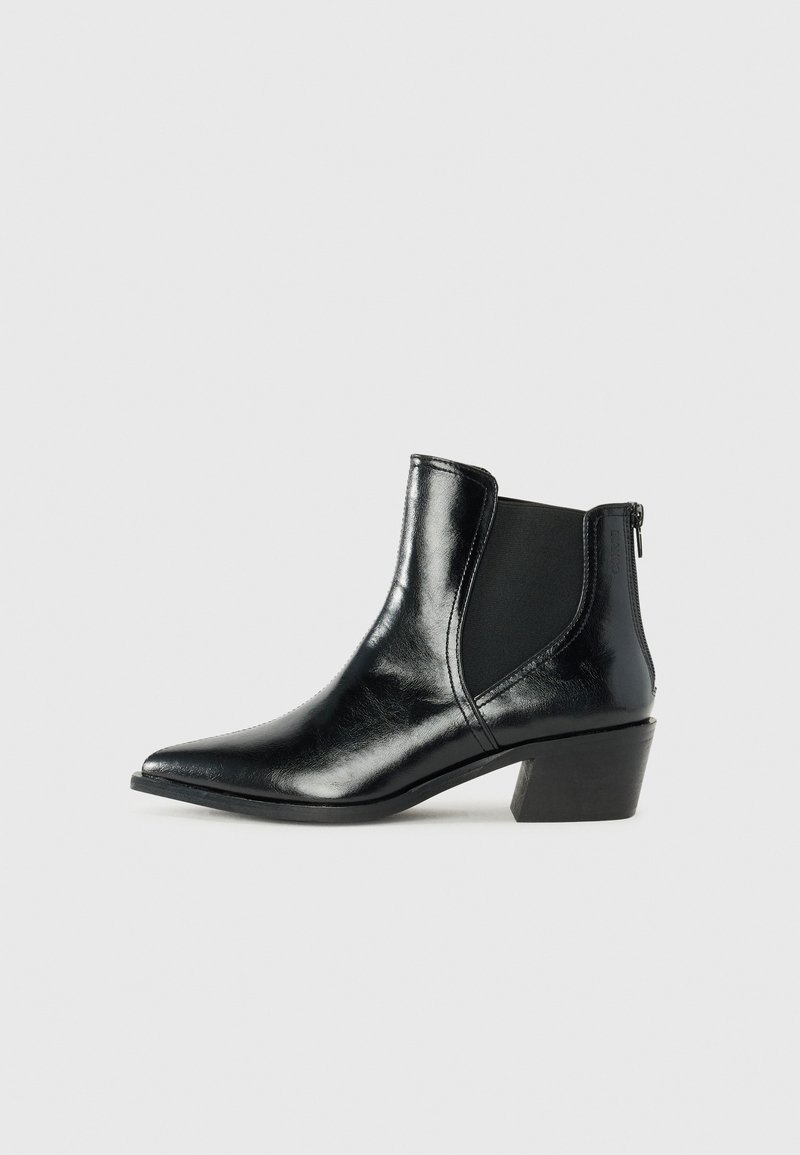 Black ankle boots with a pointed toe, glossy leather material, elastic side panels, and a low block heel. Side zipper detail included.