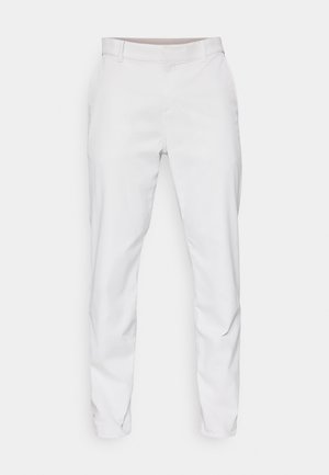 Vita byxor med en slät väv, slim fit-design och platt fram. Inga synliga fickor eller mönster. Ren fåll vid anklarna.