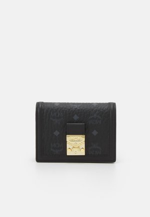 Black leather wallet with embossed pattern, gold clasp closure, and rectangular shape. Displays brand logo and diamond motifs. Smooth texture.