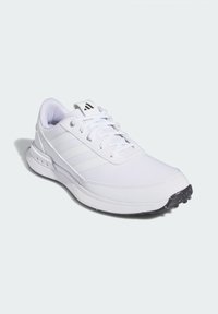 White athletic shoe with synthetic mesh upper, three diagonal stripes, thick cushioning, and rubber outsole featuring textured grip.