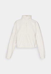 Fleece pullover, light cream color, zip-up collar, loose fit, elastic cuffs and hem, features a small logo in the top left corner.