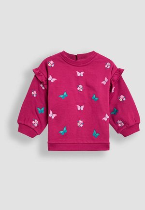 Felpa fucsia con ricami floreali e di farfalle, dettagli arricciati sulle spalle e maniche lunghe. Materiale morbido, colletto e polsini a coste.