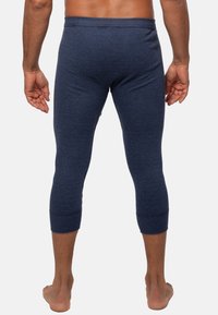 Marine gestreifte Leggings mit glatter Textur, figurbetonter Form und Knöchellängen-Ärmel. Verfügt über einen elastischen Bund für zusätzlichen Komfort.