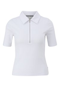 Polo blanc côtelé avec une courte fermeture éclair et des manches courtes. Doté d'un col classique et d'une texture lisse.