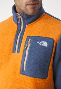 The North Face YUMIORI pomarańczowy