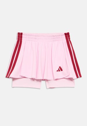 Roosa sportseelik sisseehitatud lühikeste pükstega, millel on punased küljeribad ja ees kolmnurkne logo. Mugavuse tagamiseks on elastne vöökoht.