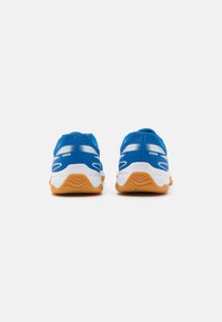 Blue athletic shoes with white accents and a textured orange sole. Features mesh fabric and a rounded toe design. Back view shown.