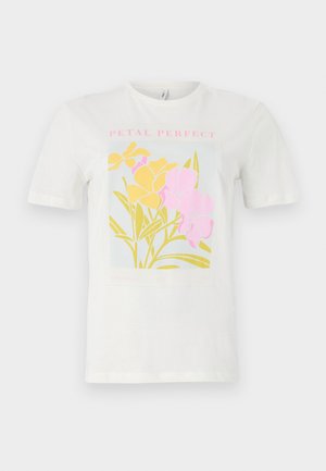 T-shirt en coton blanc avec un imprimé floral coloré comprenant des fleurs jaunes et roses, avec le texte encadré "PETAL PERFECT" en rose, sur un fond bleu clair.