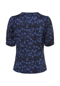 Blouse bleu foncé à manches bouffantes avec imprimé floral bleu moyen dispersé et poignets élastiques, vue de dos sur fond blanc.