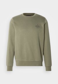 Felpa girocollo verde khaki con polsini e orlo ribbed, caratterizzata da un piccolo logo e testo di Tommy Hilfiger sul lato sinistro del petto.