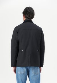 Barbour WINTER OGSTON WATERPROOF JACKET - Jachetă impermeabilă - black