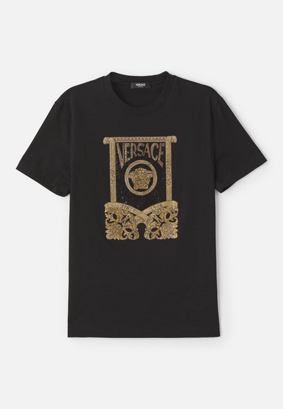 Zwarte katoen t-shirt met een gouden paillettenafbeelding van het "Versace"-logo en uitgebreide ontwerpen aan de onderkant en zijkanten.