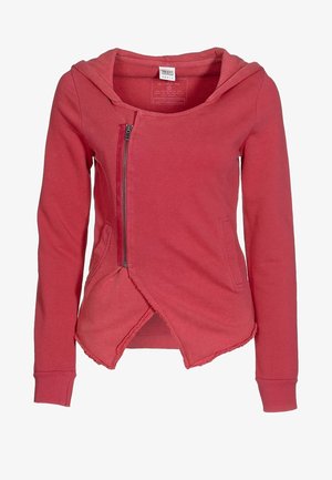 Sweat à capuche rouge asymétrique avec fermeture éclair, manches longues, poches avant et ourlet à bords francs.