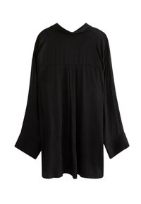 Sort langærmet skjorte med brede manchetter, samlet søm over den øverste ryg og en afslappet pasform, vist fra bagsiden på en hvid baggrund.