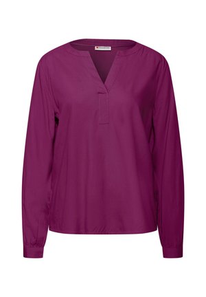 Blouse à manches longues et en V en tissu uni violet foncé. Texture douce, avec une coupe décontractée et un détail froncé subtil aux poignets.