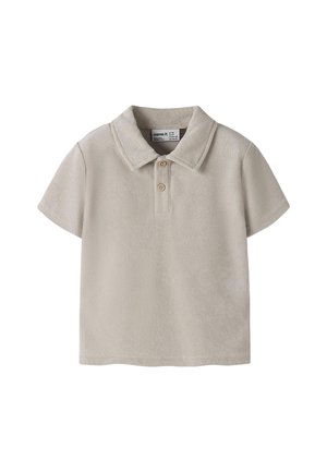 Polo à manches courtes pour tout-petit en tissu éponge beige avec deux boutons en bois et col plié.
